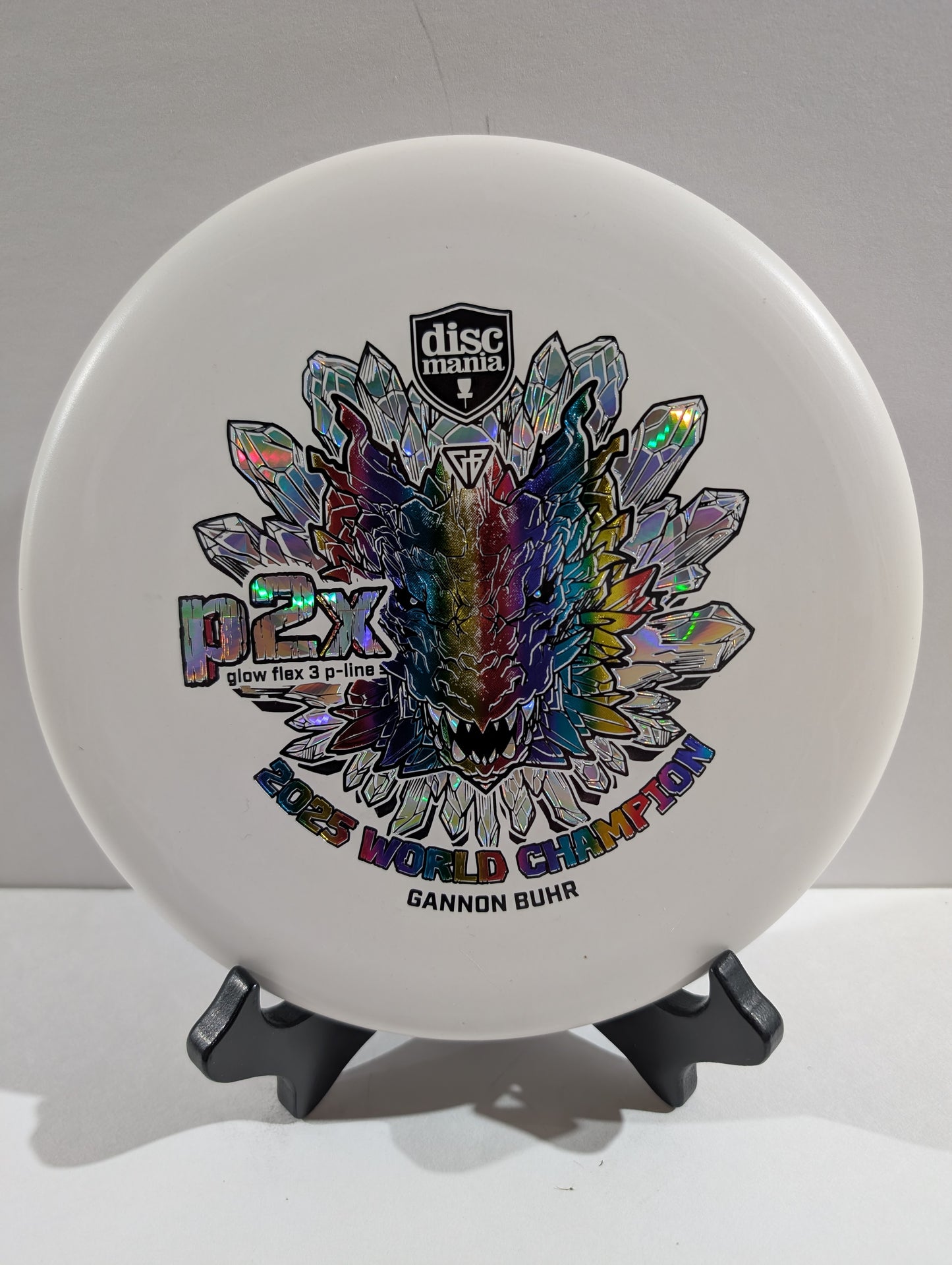 White p2x disc with rainbow tricolor dragon stamp
