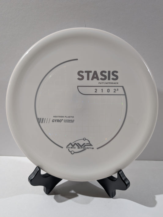 White disc golf putter with 'Stasis' branding on a gray background