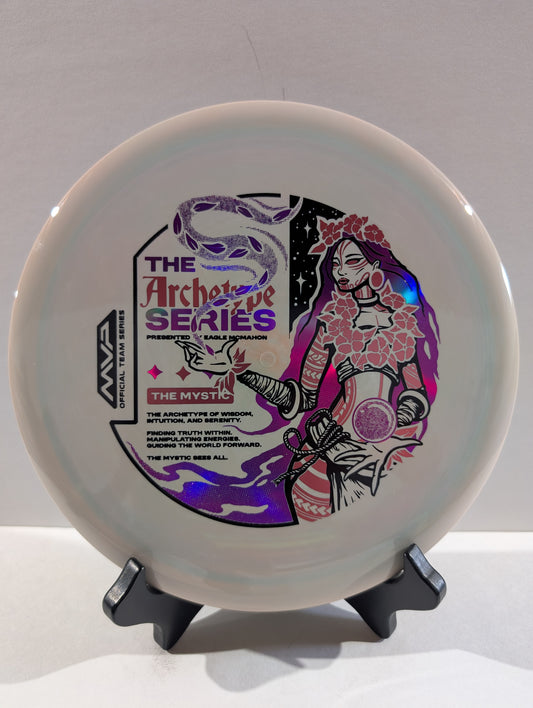 Disc with artistic design and text on a stand against a gray background