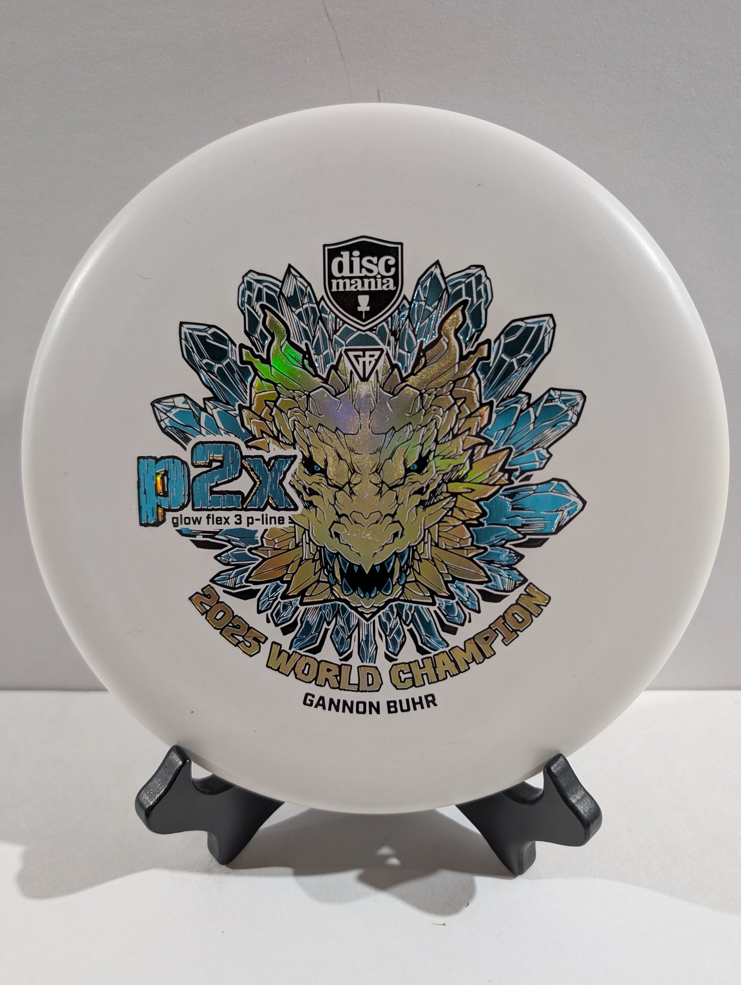 White p2x disc with gold tricolor dragon stamp