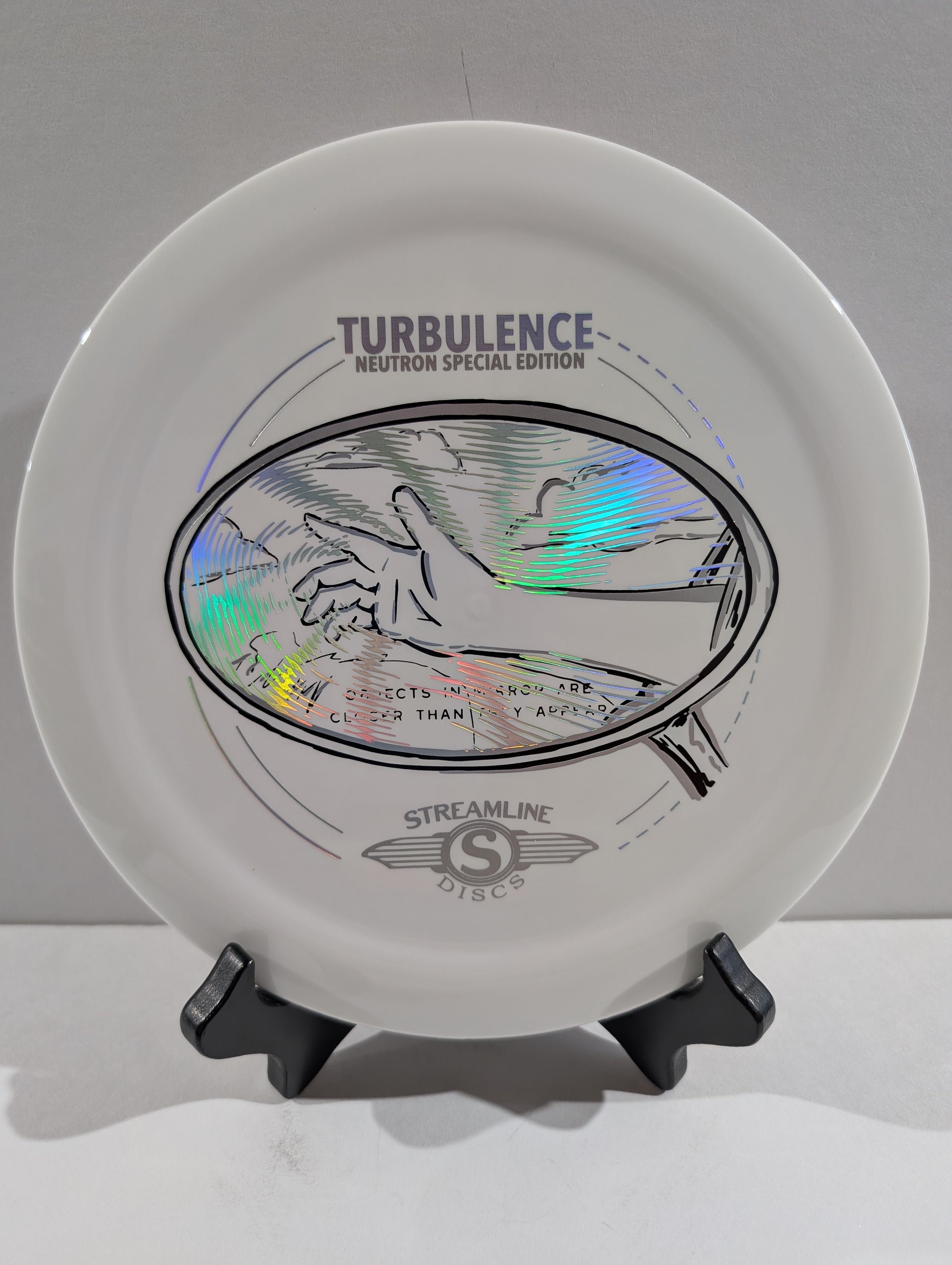 White disc with 'Turbulence' and 'Streamline Discs' branding on a stand.