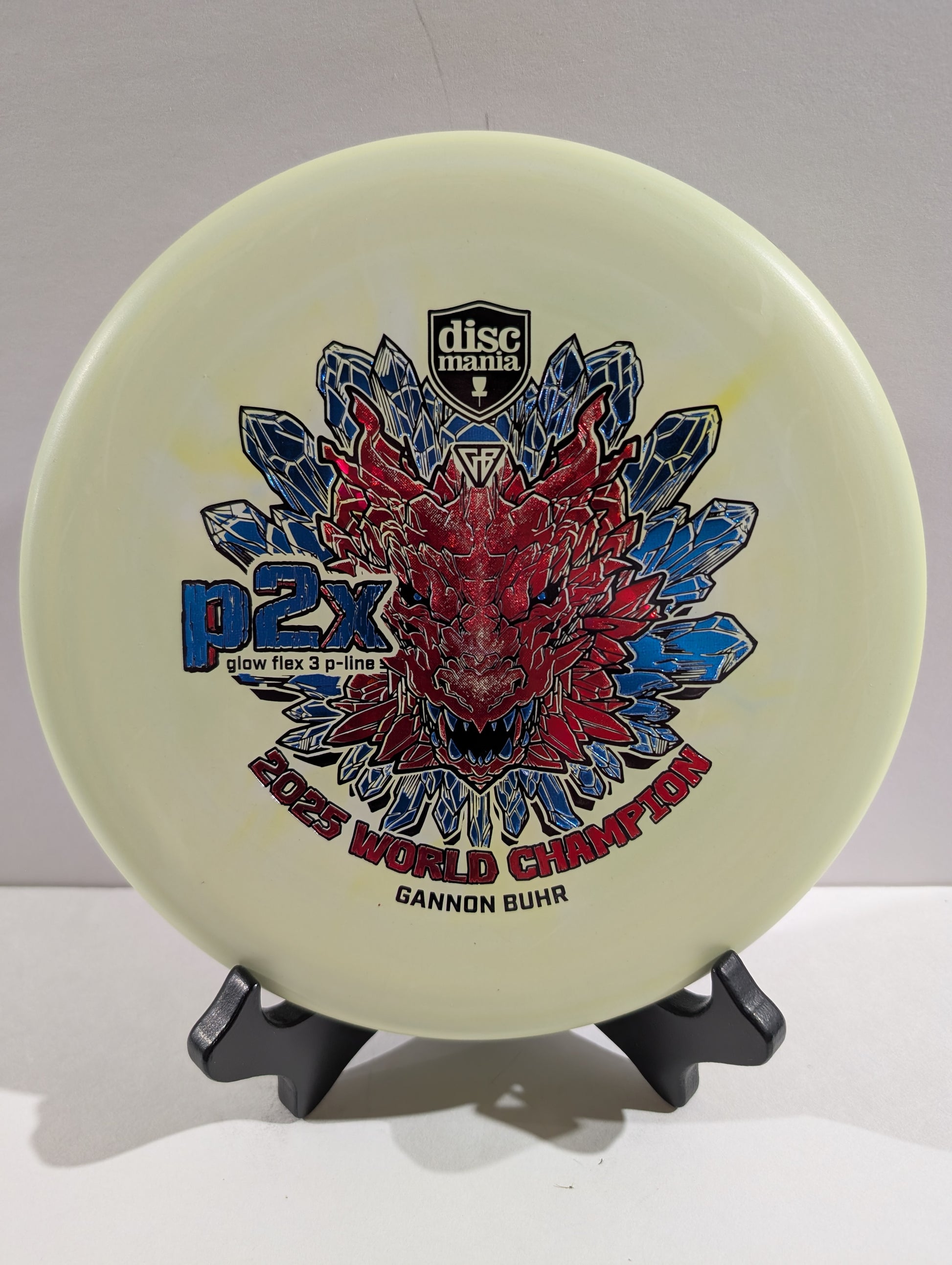 Green p2x disc with red tricolor dragon stamp