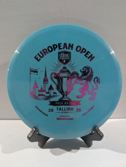 A light blue Discmania European Open disc golf disc displayed on a small black stand against a neutral light gray background.