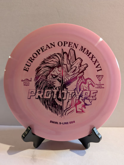 Pink disc golf disc with branding and text on a stand against a neutral background