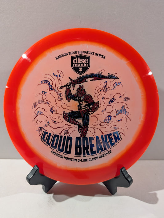 Disc golf disc with 'Cloud Breaker' design on a stand against a gray background