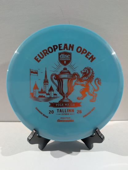 A light blue Discmania European Open disc golf disc displayed on a small black stand against a neutral light gray background.