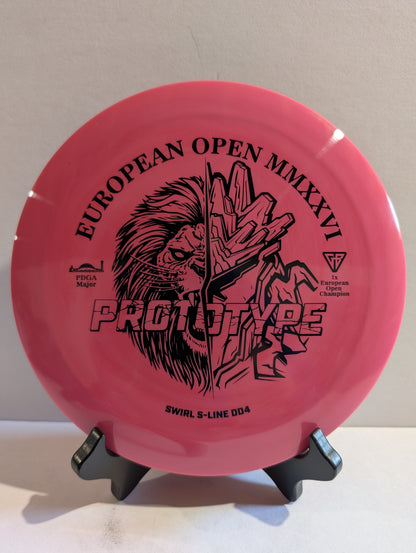 Pink disc golf disc with black text and graphics on a stand against a beige background