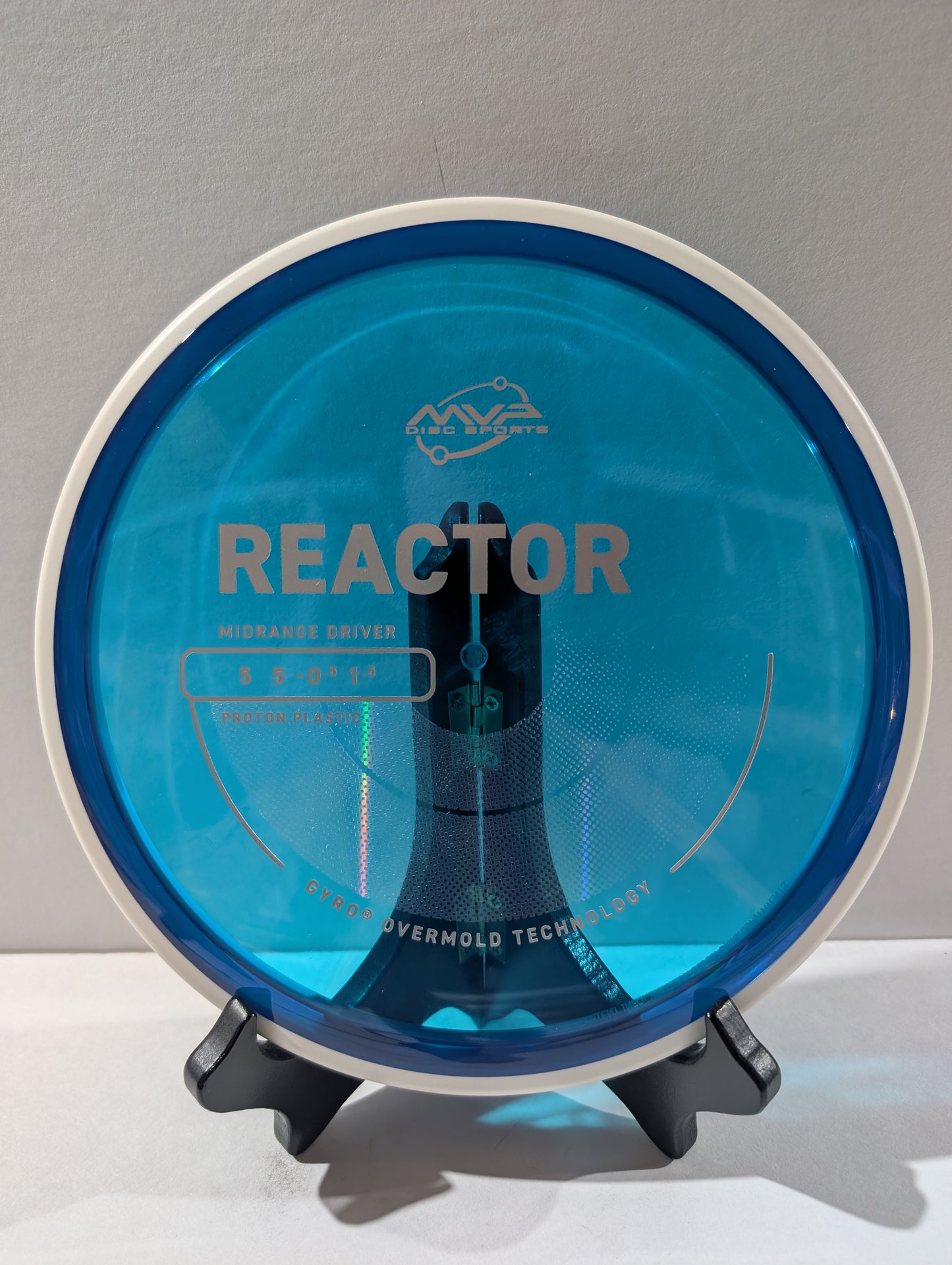 Blue disc golf driver with 'Reactor' branding on a gray background
