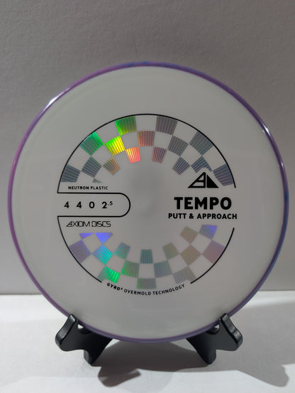 Disc golf disc with 'Tempo Putt & Approach' branding on a stand against a white background