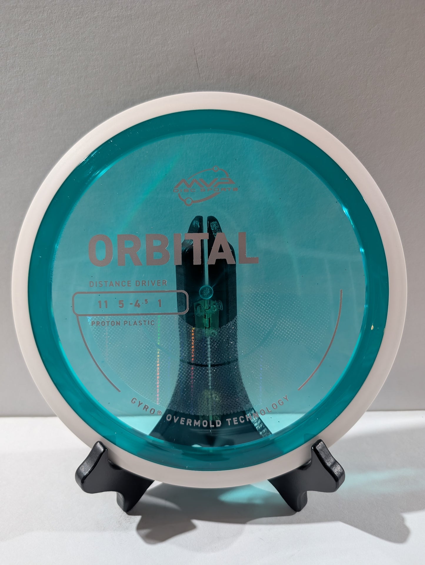 Disc golf disc with 'Orbital' branding on a gray background