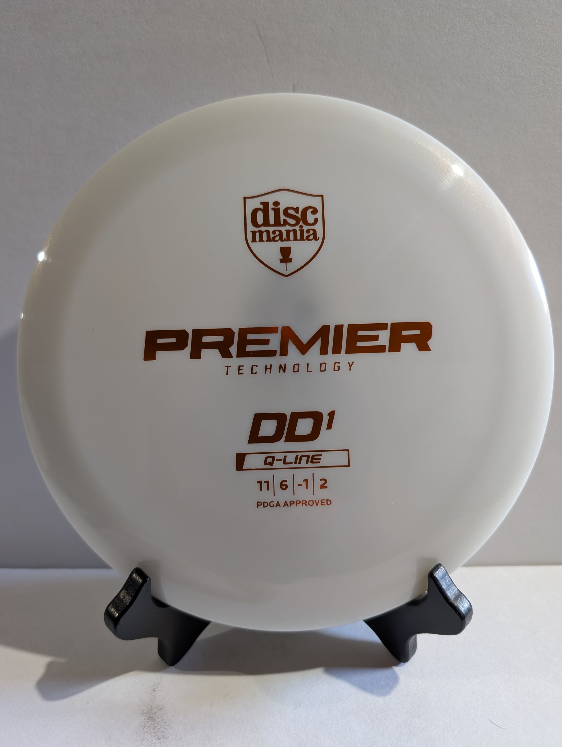 Discmania DD1 disc golf disc on a stand with a white background