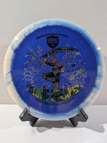 Blue and white disc with 'Discmania' branding and graphics on a stand against a light gray background