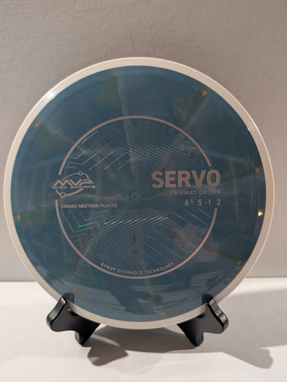 Blue disc golf disc on a stand against a gray background