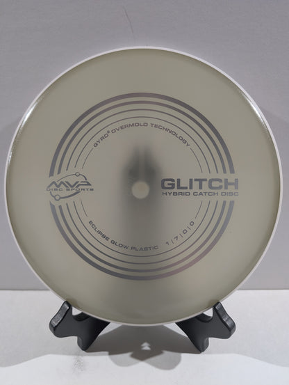 Disc golf disc with 'MVP' branding on a stand against a white background