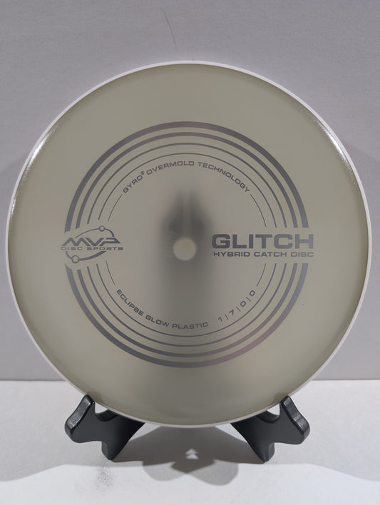 Disc golf disc with 'MVP' branding on a stand against a white background