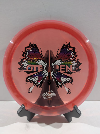 Pink disc with butterfly design and 'OTB Open' text on a stand against a white background