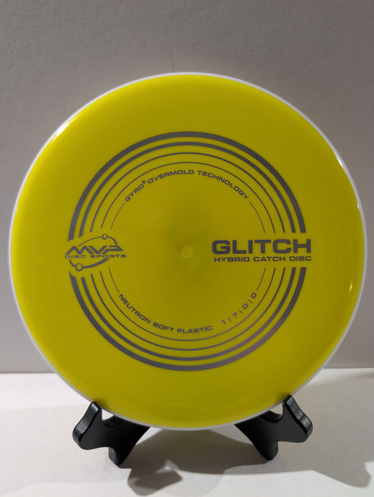 Yellow disc with 'Glitch' branding on a stand against a gray background