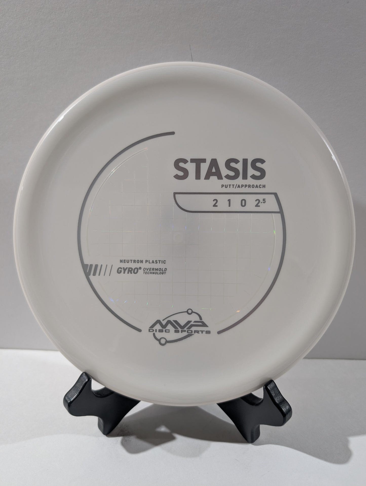 White disc golf putter with 'Stasis' branding on a gray background