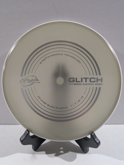 Disc golf disc with branding on a stand against a plain background