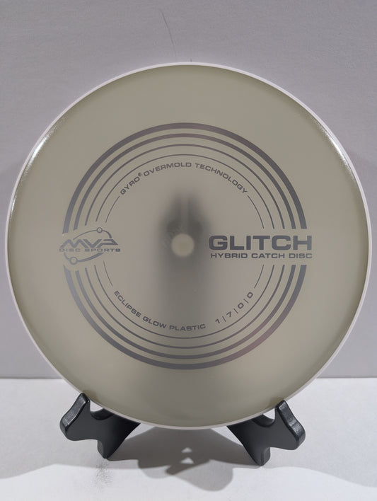 Disc golf disc with branding on a stand against a plain background