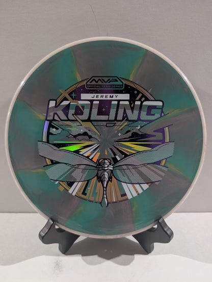 Disc golf disc with branding and design on a stand against a neutral background