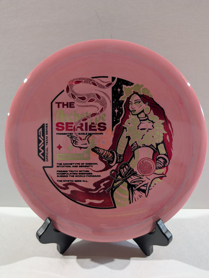 Pink disc with graphic design on a stand against a gray background