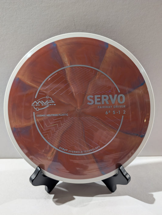 Disc golf disc with 'Servo' branding on a stand against a neutral background
