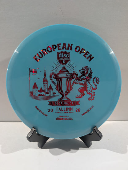 A light blue Discmania European Open disc golf disc displayed on a small black stand against a neutral light gray background.