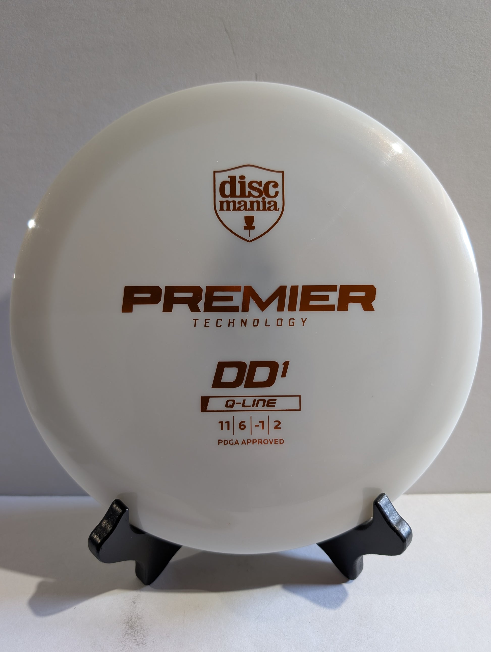 Discmania disc golf disc on a stand with 'Premier Technology' and 'DD1' text.