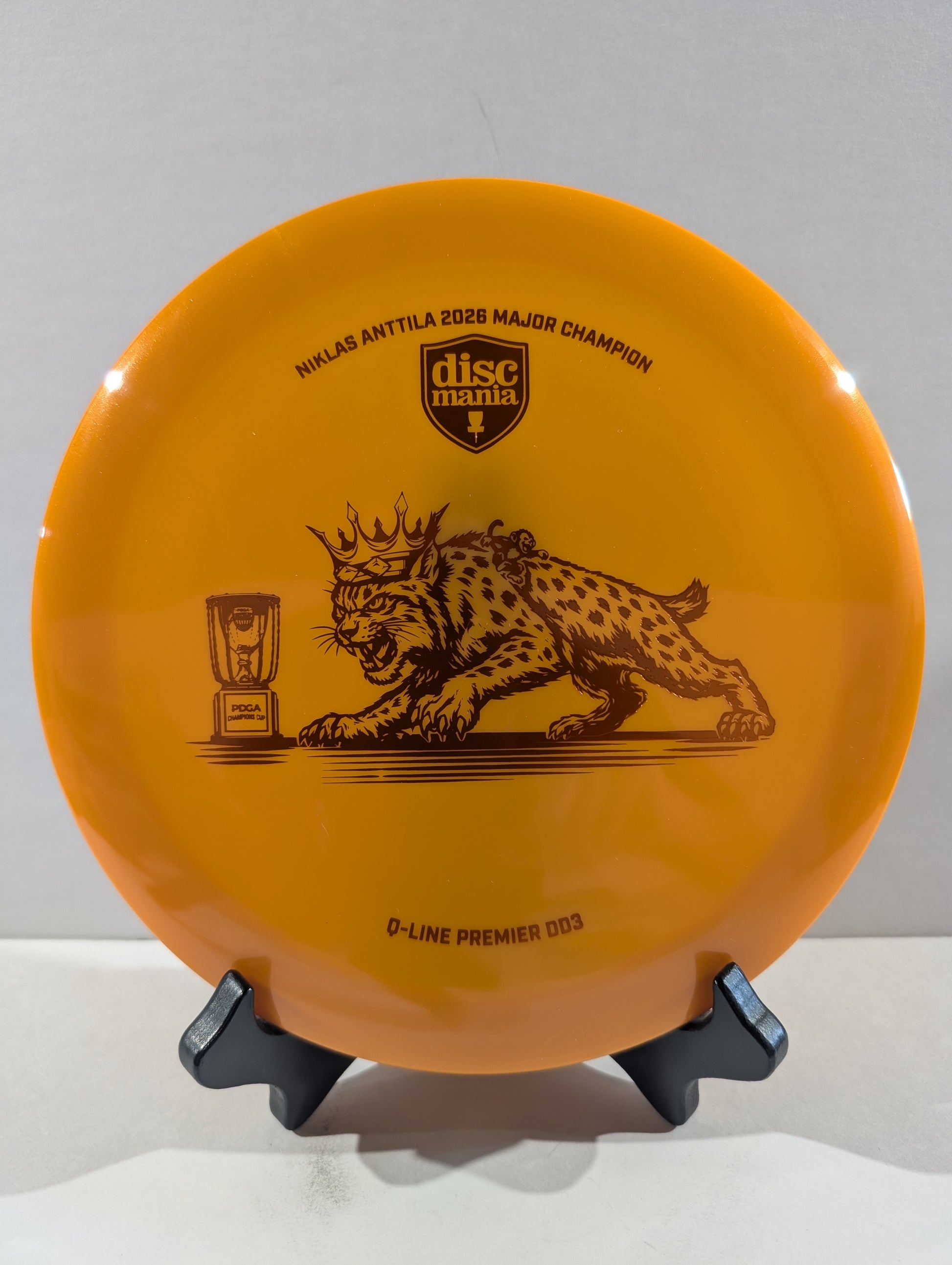 Orange disc with a orange cat design on a white background