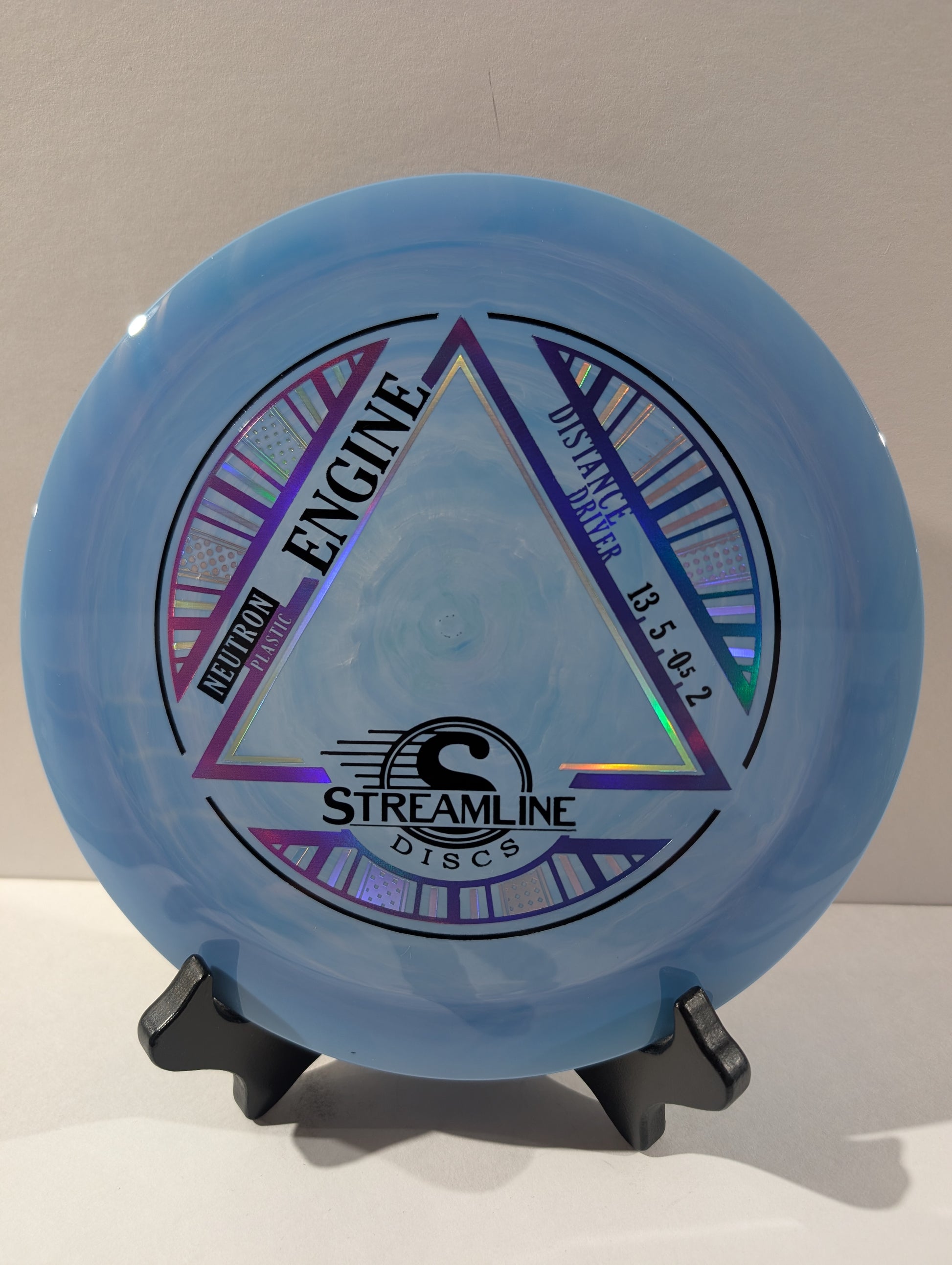 Blue disc with 'Streamline Discs' branding on a stand against a neutral background
