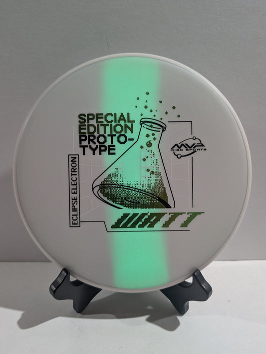 Disc with green glow-in-the-dark effect and text on a gray background