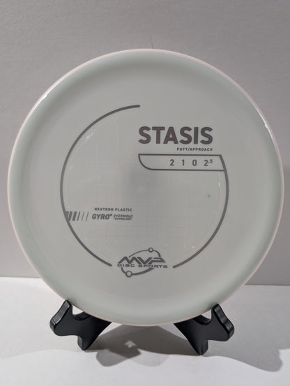 Disc golf disc with 'Stasis' branding on a gray background
