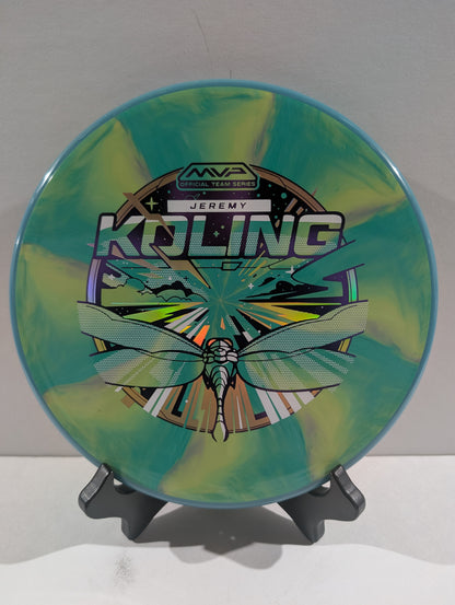Disc golf disc with colorful design and branding on a stand against a white background