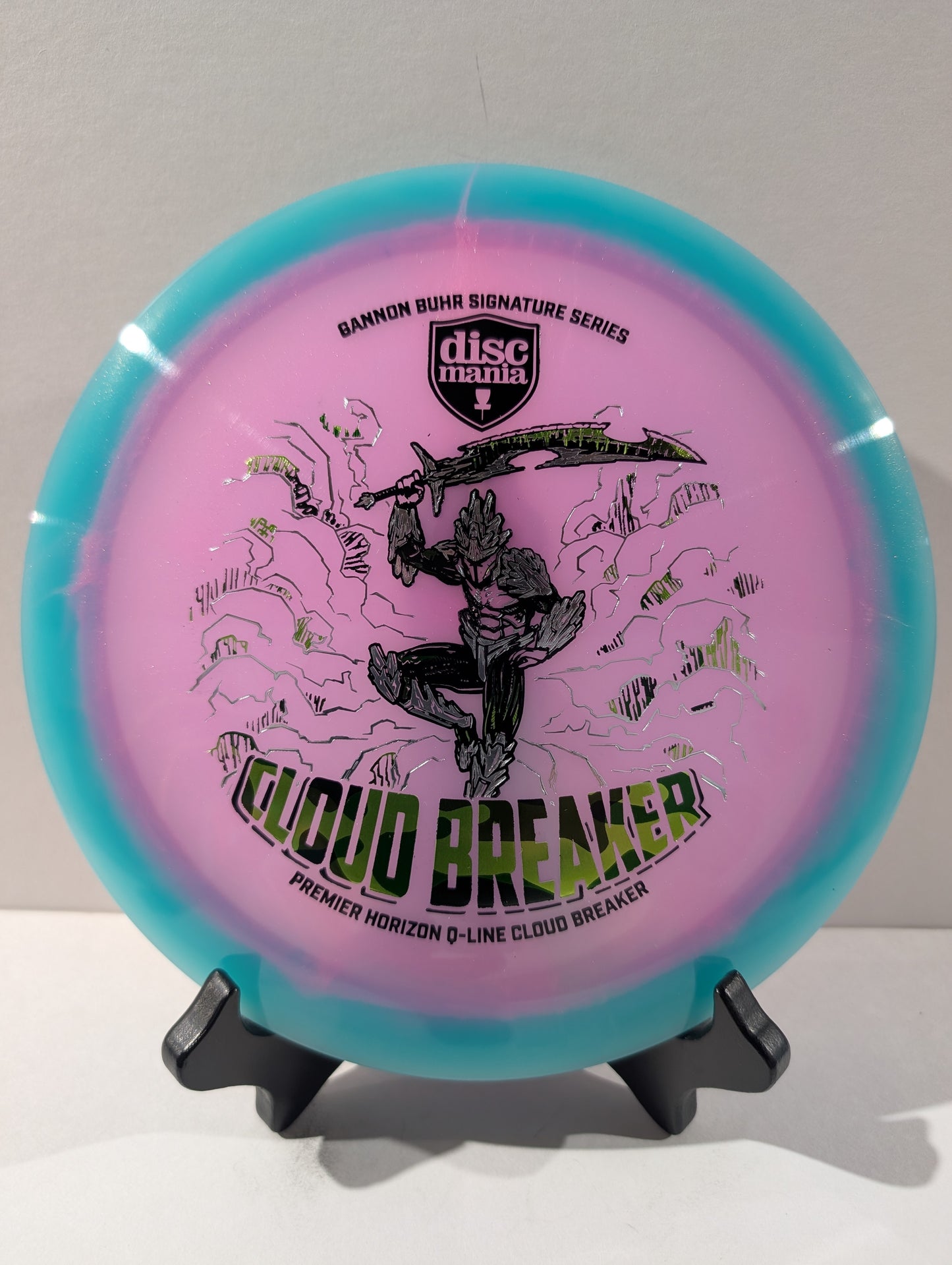 Discmania Cloud Breaker disc golf disc on a stand with a white background