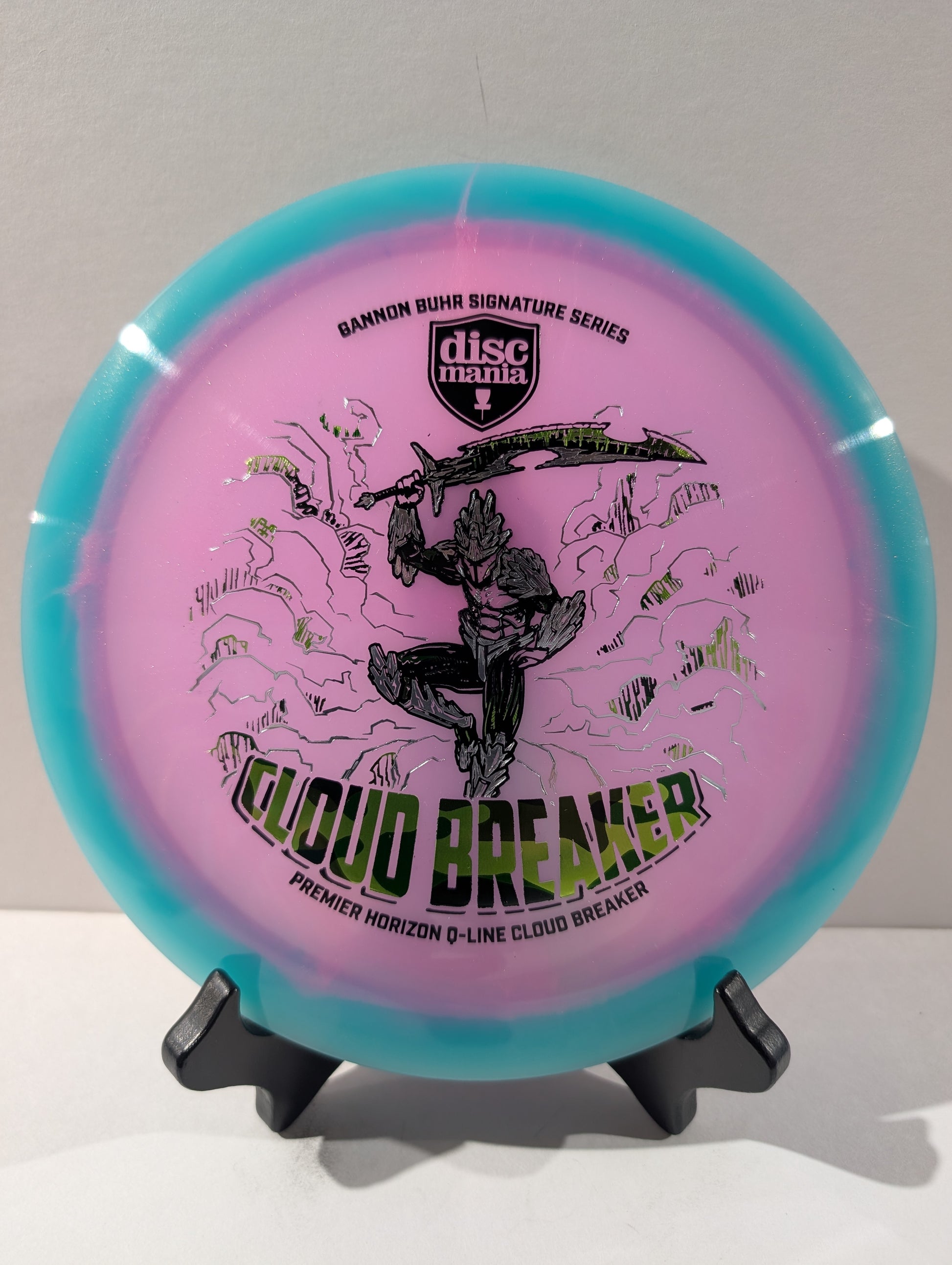 Discmania Cloud Breaker disc golf disc on a stand with a white background