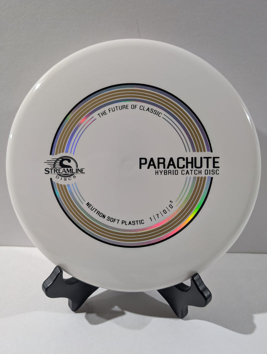 White disc with 'Parachute' branding on a gray background
