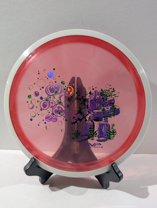 Red disc golf disc with a design on a stand against a white background
