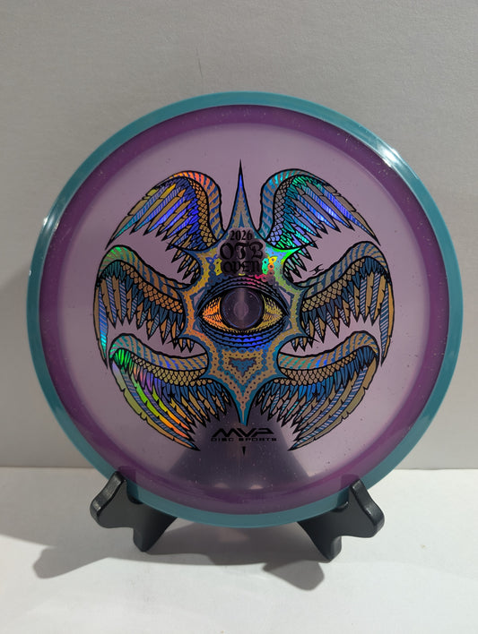 Disc with colorful design on a stand against a white background