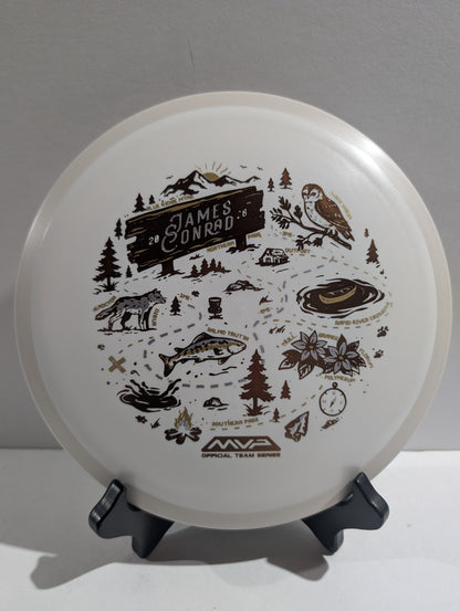 Disc with nature-themed design on a stand against a white background