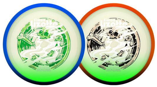 Two disc golf discs with the Simon Lizotte signature design, one with a blue outer ring and green center, and one with an orange outer ring and green center, shown side-by-side on a white background.